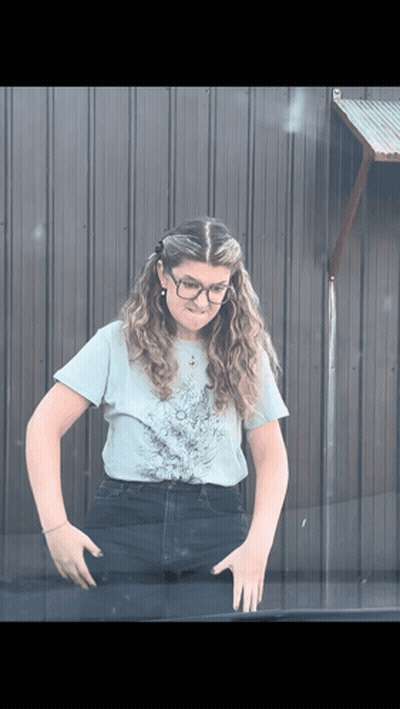 Woman In Glasses And Light Blue Shirt GIF