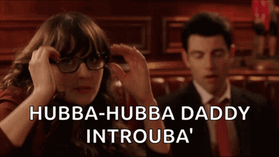 Woman In Glasses And Man In Suit Sitting In Bar GIF