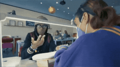 Woman In Glasses And Mask Looking In Mirror GIF