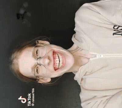 Woman In Glasses And Ms Hoodie Smiling GIF