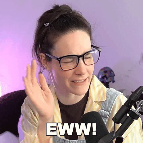 Woman In Glasses And Overalls Says Eww GIF