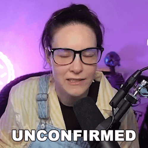 Woman In Glasses And Overalls Sitting In Front Of Microphone Unconfirmed GIF