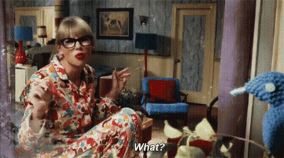 Woman In Glasses And Pajamas Talking To Stuffed Animal GIF