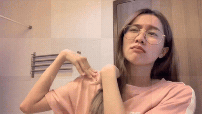 Woman In Glasses And Pink Shirt With Letter S GIF