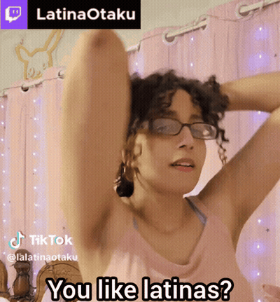 Woman In Glasses And Pink Tank Top Asking If She Likes Latinas GIF