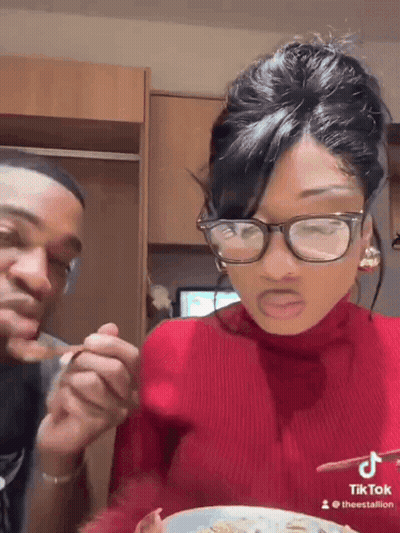Woman In Glasses And Red Sweater Eating GIF