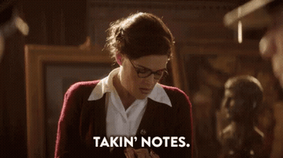 Woman in Glasses and Red Sweater Saying Takin Notes