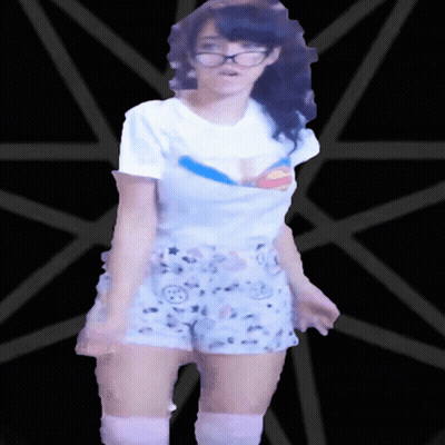 Woman In Glasses And Shorts In Front Of Black Star GIF