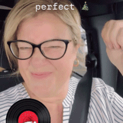 Woman In Glasses And Striped Shirt Holding Record Saying Perfect GIF