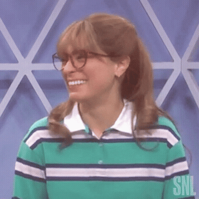 Woman In Glasses And Striped Shirt Smiling GIF