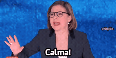 Woman In Glasses And Suit Saying Calma GIF