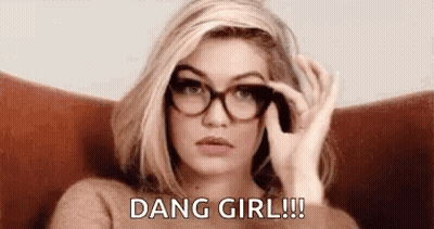Woman In Glasses And Sweater Sitting In Chair GIF