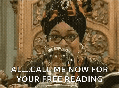 Woman In Glasses And Turban Holding Crystal Ball GIF
