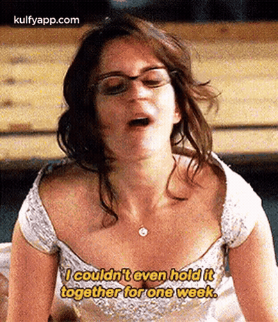 Woman In Glasses And White Dress Sitting On Bench With Mouth Open GIF