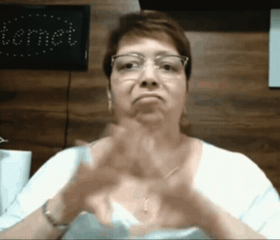 Woman In Glasses And White Shirt Making Funny Face GIF