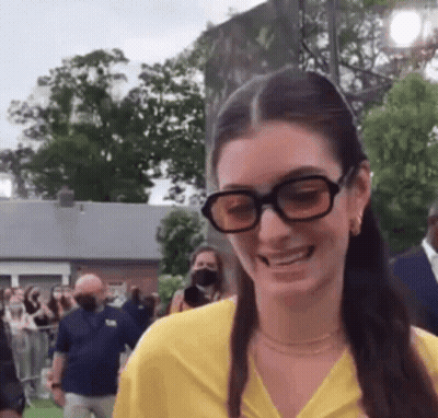 Woman In Glasses And Yellow Shirt Smiling GIF