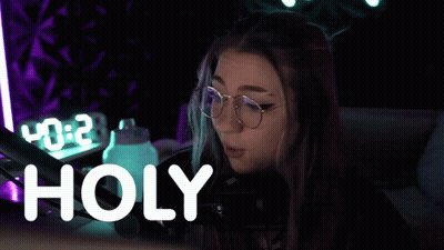 Woman In Glasses At Microphone Saying Holy GIF