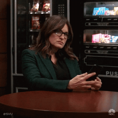 Woman In Glasses Looking At Phone GIF