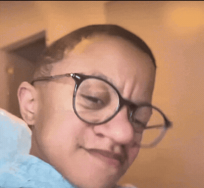 Woman In Glasses Making A Face GIF