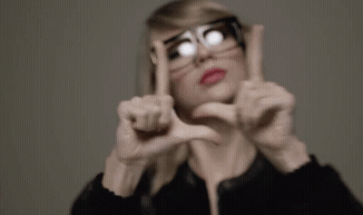 Woman In Glasses Making Heart Shape GIF
