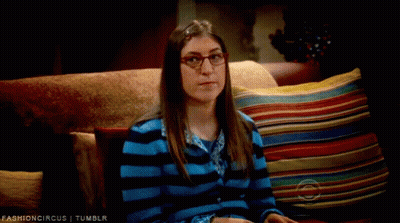 Woman In Glasses On Couch With Colorful Pillows Fashioncircus Tumblr GIF