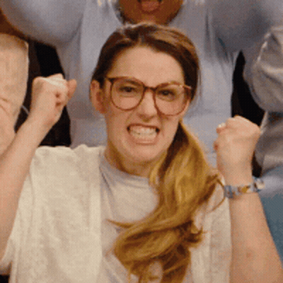 Woman In Glasses Raising Fist GIF