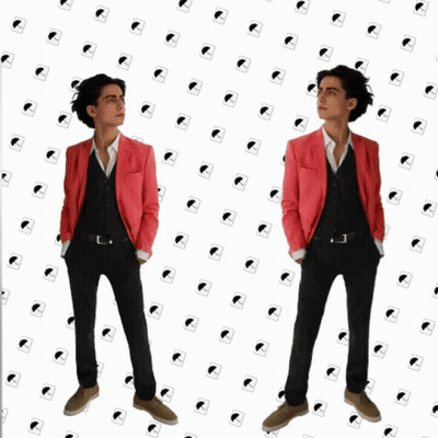 Woman In Glasses Says Alright To Man In Suit GIF