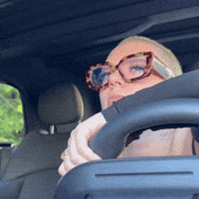 Woman In Glasses Sitting In Car GIF