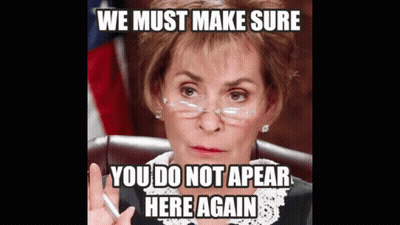 Woman In Glasses Sitting With Meme Saying We Must Make Sure You Do Not Appear Here Again GIF