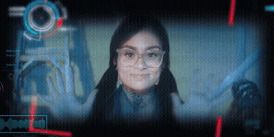 Woman In Glasses Smiling At I'm A Robot Screen GIF