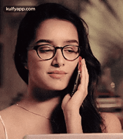 Woman In Glasses Talking On Phone GIF