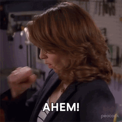 Woman In Glasses Wearing Suit Ahem GIF