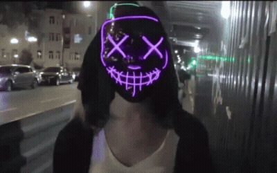 Woman In Glow In The Dark Smiley Mask GIF