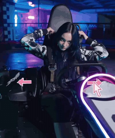 Woman In Go Kart With Pink Arrow Pointing Left GIF