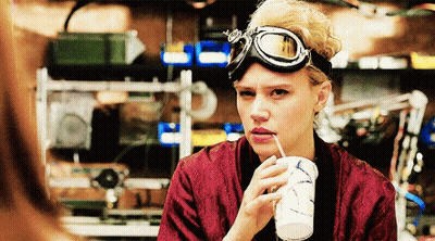 Woman in Goggles Drinking Through Straw