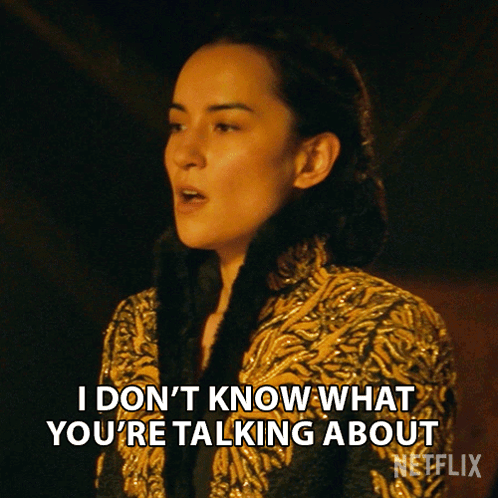 Woman In Gold Coat Says I Don't Know GIF