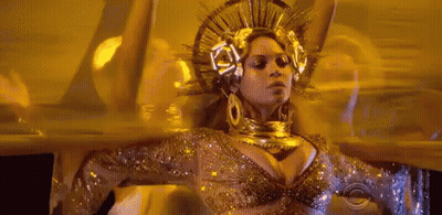 Woman In Gold Crown And Earrings Dancing GIF