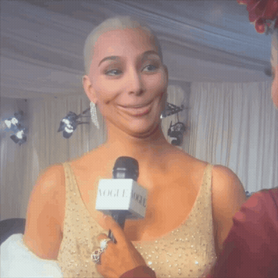 Woman in Gold Dress Being Interviewed