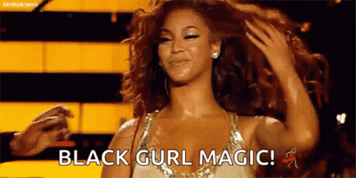 Woman In Gold Dress Holding Hair Saying Black Curl Magic GIF