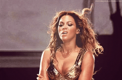 Woman In Gold Dress Making Funny Face On Stage GIF