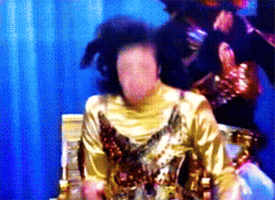 Woman In Gold Dress No Face GIF