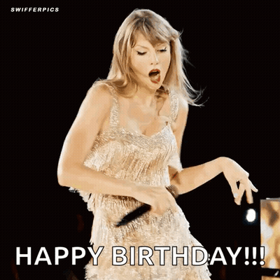 Woman In Gold Dress Singing Into Microphone GIF