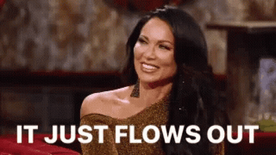Woman In Gold Dress Smiling Says It Just Flows Out GIF