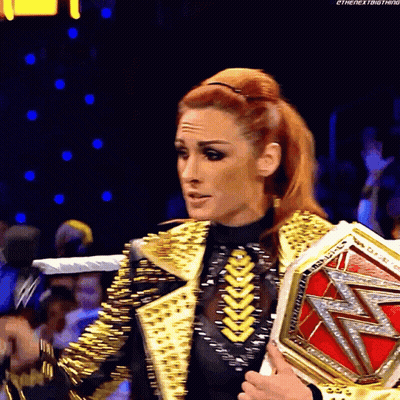 Woman In Gold Jacket Holding Wrestling Championship GIF