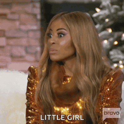 Woman In Gold Sequined Dress Making Funny Face Saying Little Girl GIF