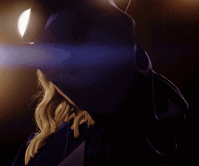 Woman In Graduation Cap And Gown GIF