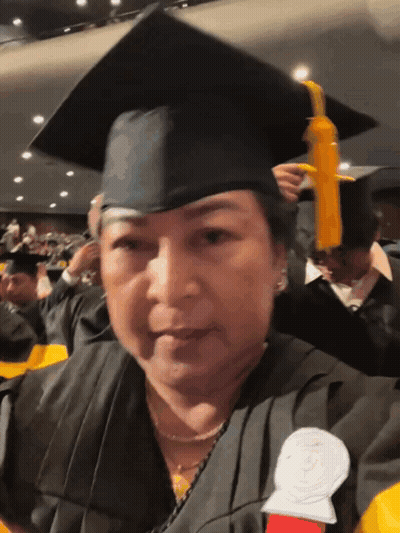 Woman In Graduation Cap And Gown GIF