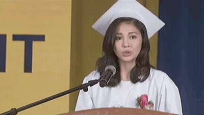Woman In Graduation Cap And Gown At Podium GIF