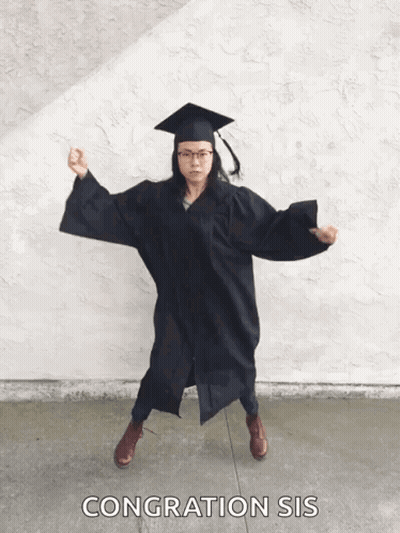 Woman In Graduation Cap And Gown Dancing GIF