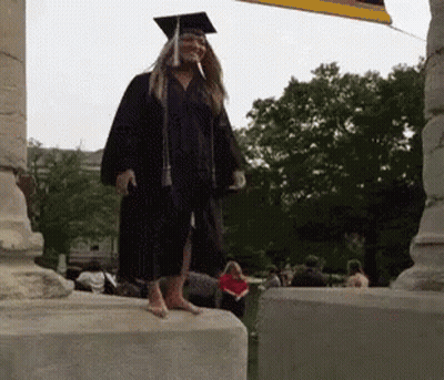 Woman In Graduation Cap And Gown GIF